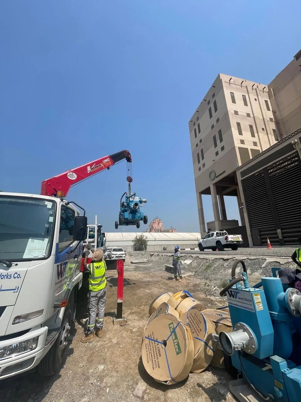 WellTech crane truck placing a pump on site