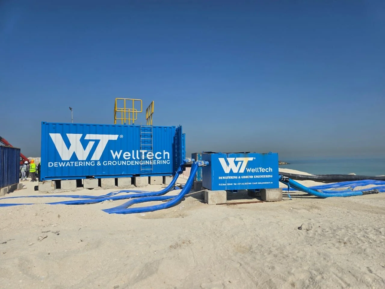 WellTech collection tanks and discharge hoses on a coastal site
